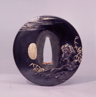 Tsuba (sword guard) decorated with a magic fox disguising itself as a woman