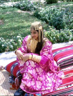 Young woman wearing an elaborate silver headdress of the type used for wedding ceremonies