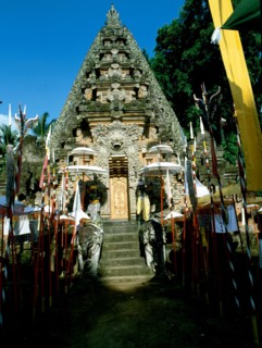The covered gate at a temple in Ubud adorned for a festival