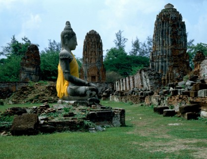 The temple ruins of Wat Chaiwatthanaram and Buddha statue