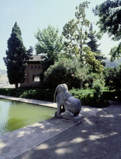 Stone lions at the pool of the Partal in front of the Torre de las Damas, Alhambra Palace, Granada