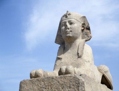 One of a pair of sphinxes in pink Aswan granite set up at the foot of the column known as "Pompey's Pillar", after they were found nearby in 1906