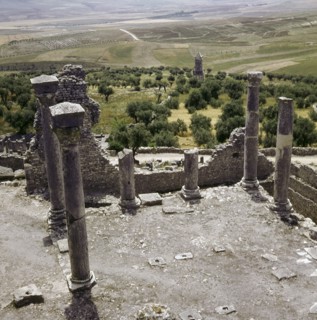 A Numidian Berber tomb built by Punic craftsmen seen from the ruins of the Roman city of Dougga