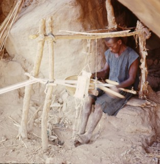 Dogon weaver, using a local variant of the narrow-strip double-heddle loom common throughout West Africa