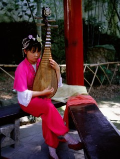 Instrument of ancient design played by a female musician dressed in Song style