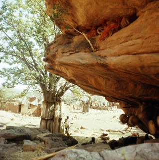 Niches at the base of the high cliffs above the village are used to store sacred masks and drums