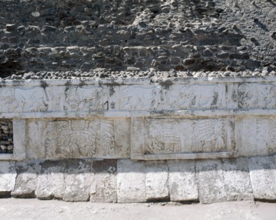 Bas relief friezes depicting jaguars and coyotes on the top and eagles devouring hearts on the bottom
