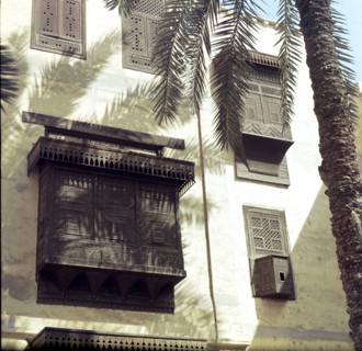 View of Cairo houses with masharabiyya (screen or grille of tined wood)