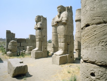 Two statues in the entrance of a corridor