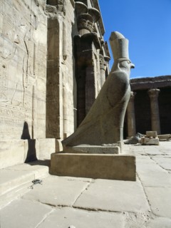 The colossal statue of the god Horus at the entrance to the Temple of Horus, Edfu