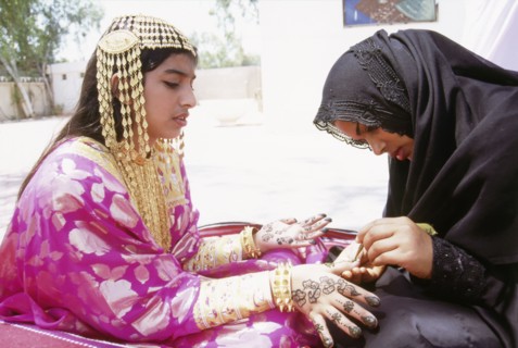 Geometric and floral decorative henna patterns were applied to adorn the hands and feet of young women on occasions such as weddings