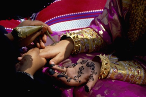 Geometric and floral decorative henna patterns were applied to adorn the hands and feet of young women on occasions such as weddings