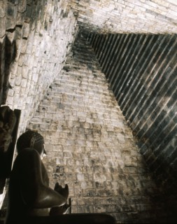 A statue of the seated Buddha in Chandi Mendut, one of the several temples associated with Borobudur