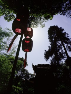 Hanging lanterns and the gate to the temple of Chuan Long Tiong (Yellow Dragon Cave)