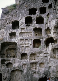 The Longmen cave-temple complex which extends for about 1000m along the Yi River