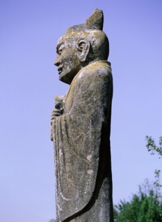 A monumental stone carving of an official wearing a Confucian-style hat