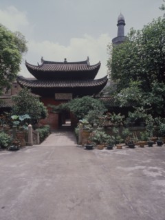 The courtyard and minaret of the Memorial Mosque to the Prophet, the Huai Sheng Si, more usually known as Beacon Tower Mosque, where the Islamic minaret rises above the roofline of traditional Chinese...