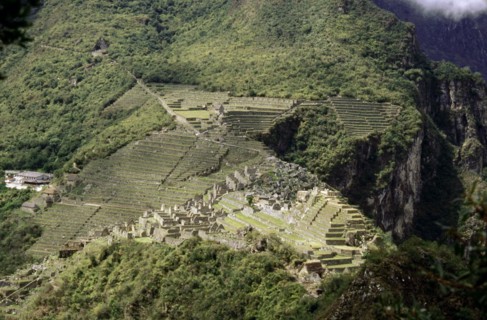 View of Machu Picchu from the summit of Huayna Picchu, showing the dramatic location of the city and its terrace system