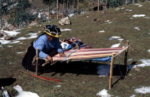Quechua 'Inca' woman weaving on a horizontal single-heddle loom