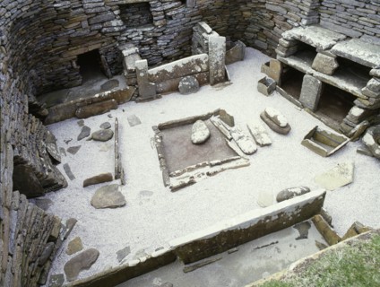 View of the interior of House 1, through the door