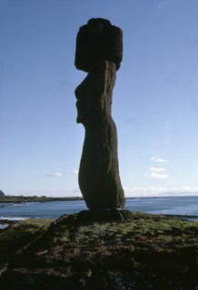 Silhouette of Moai statue with topknot, from the coast