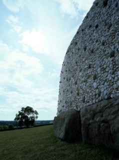 View of the stone walls that surround the heart-shaper mound covering the prehistoric passage tomb at Newgrange