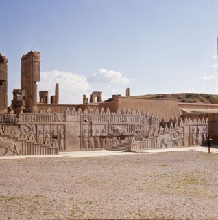 A detail of a relief carving on the staircase leading to the Tripylon at Persepolis, depicting a lion attacking a bull