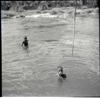 Abange's son with Banyu in river