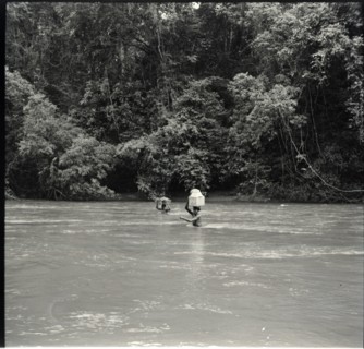 Boys crossing river