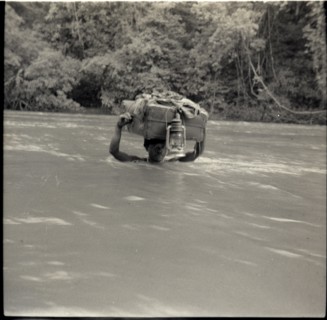Boys crossing river