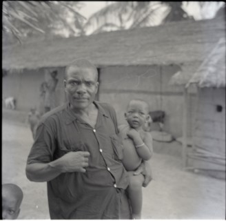 Tanyi Tiku and children in compound