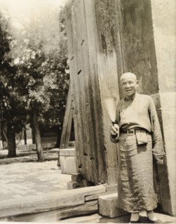 Lama priest at the doorway to a temple