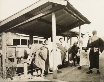 Freshening up at railway station in Manchuria