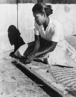 Weaving a palm mat, Dominica