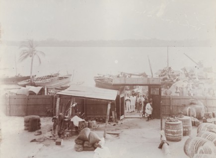View from bungalow at Badagry showing barrels of oil and bags of nuts