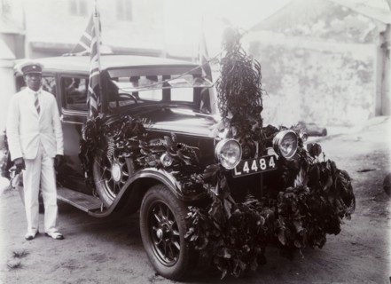 Garlanded car registration no. L4484 with chauffeur
