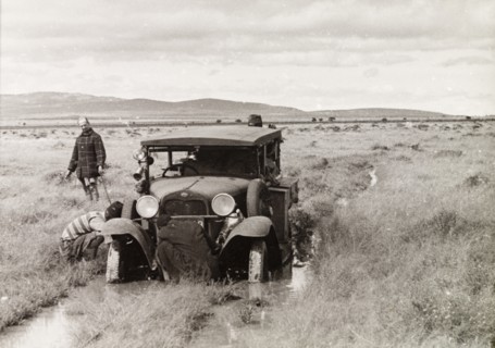 Car stuck in flooded plains