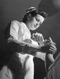 US Navy Nurse Taking A Pulse