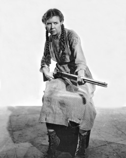 Woman Holding A Rifle