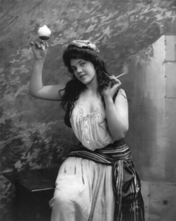A Woman Smoking And Drinking
