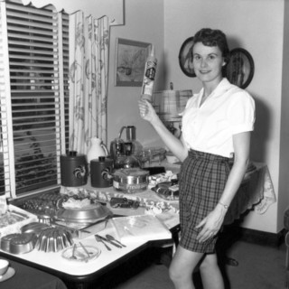 A Woman Holding A Rolling Pin
