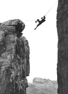 Climber Crossing On A Rope