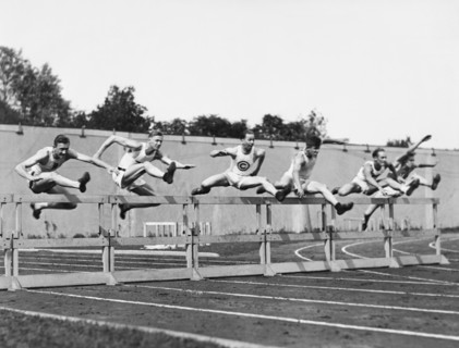 Men Running High Hurdles