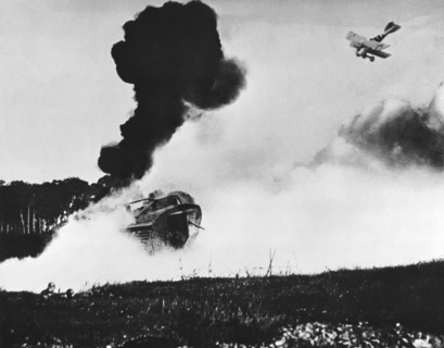 German Biplane Attacks Tank