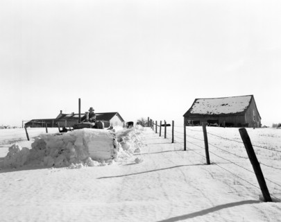 Plowing Snow With A Tractor