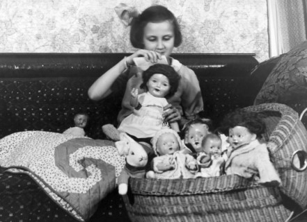 Girl With Dolls