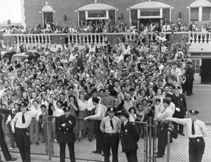 Crowd Welcomes Howard Hughes