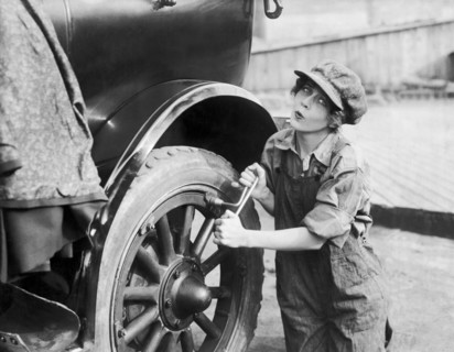 Actress Working On Her Car