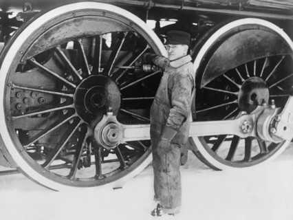 Engineer Greasing Train Wheels