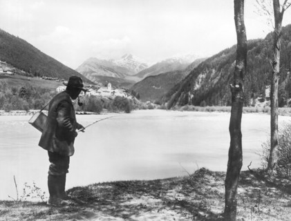 Man Fishing In Switzerland